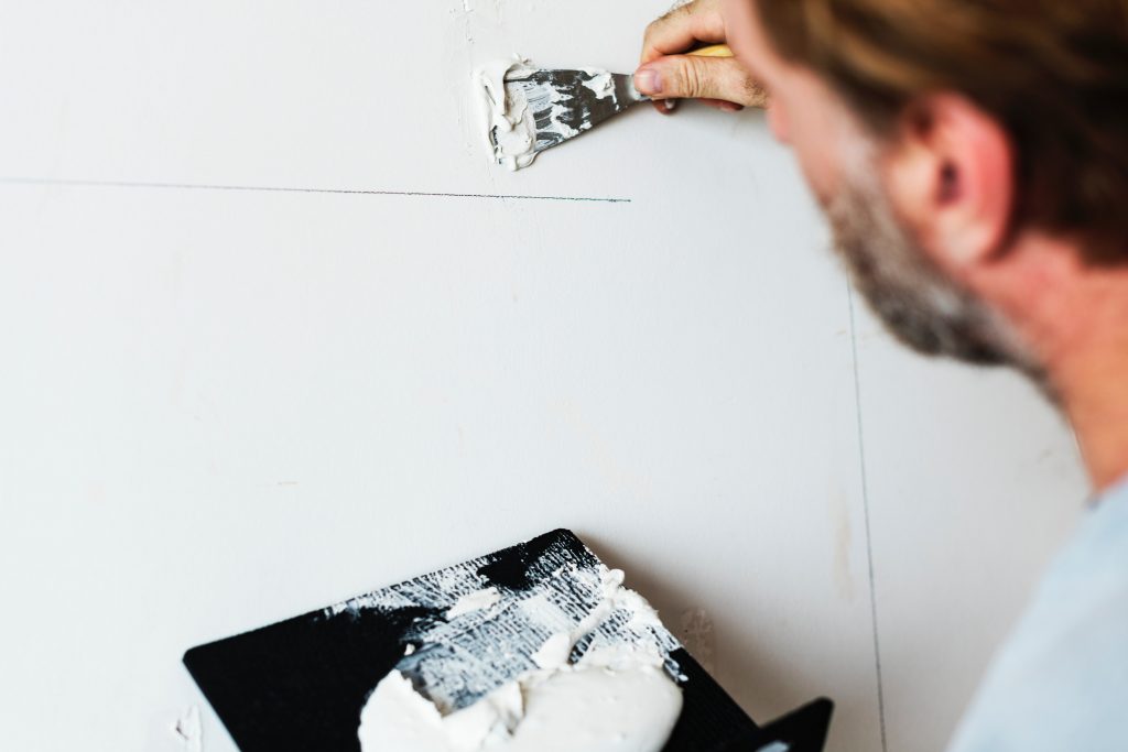 Plastering and decorating the wall